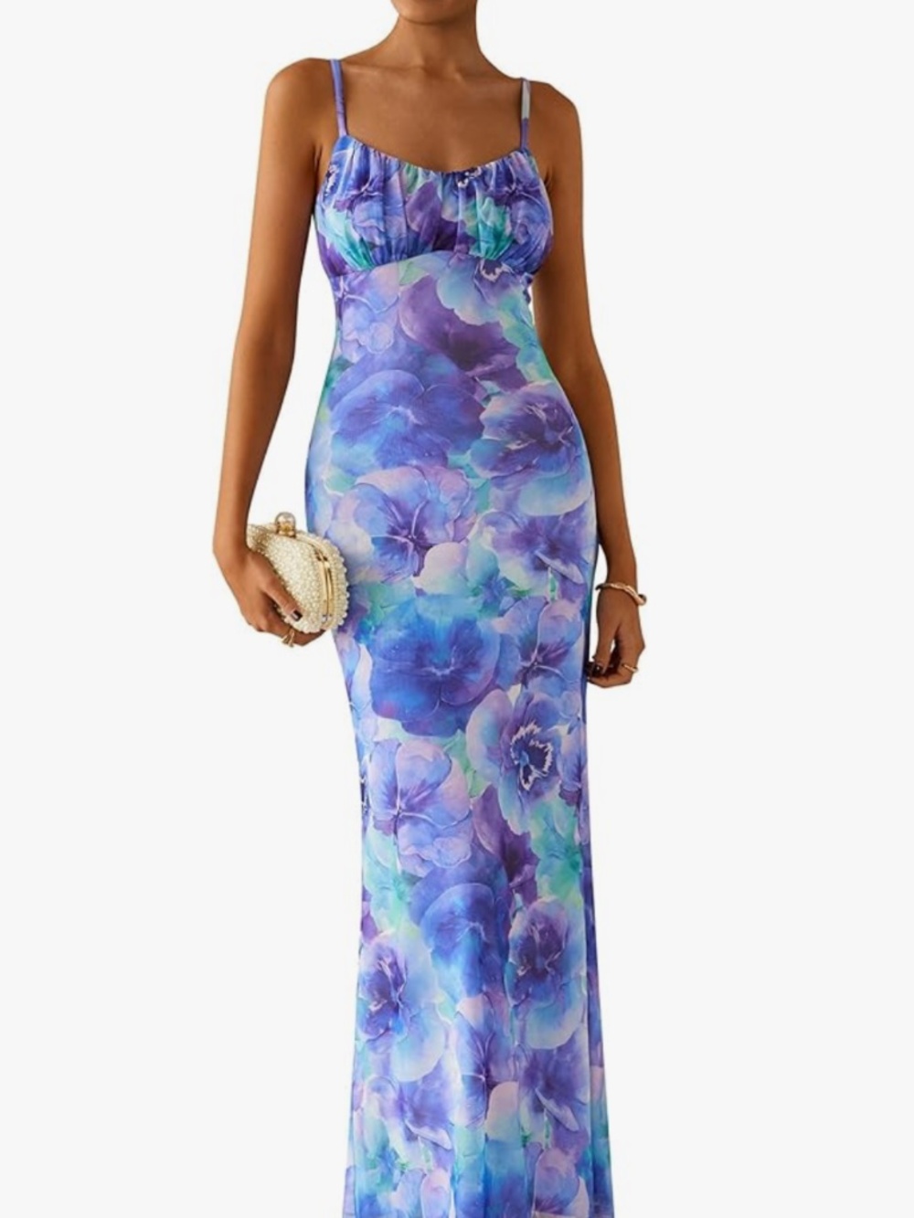 Feminine floral maxi with slim spaghetti straps. Body-skimming silhouette